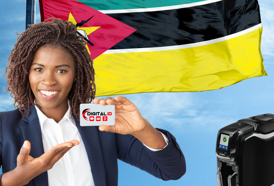 African lady holding an ID card next to a Zebra ZC300 card printer with the Mozambique flag in the background.